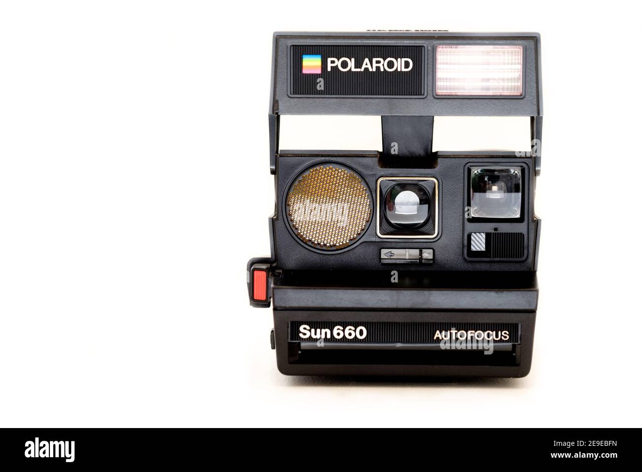 An original Polaroid sun 660 instant camera. The iconic 1980’s instant camera is shown fully open an shot against a Pali white background Stock Photo