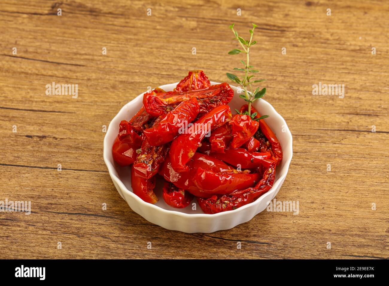 Sundried tomato in olive oil with herbs and spices Stock Photo Alamy