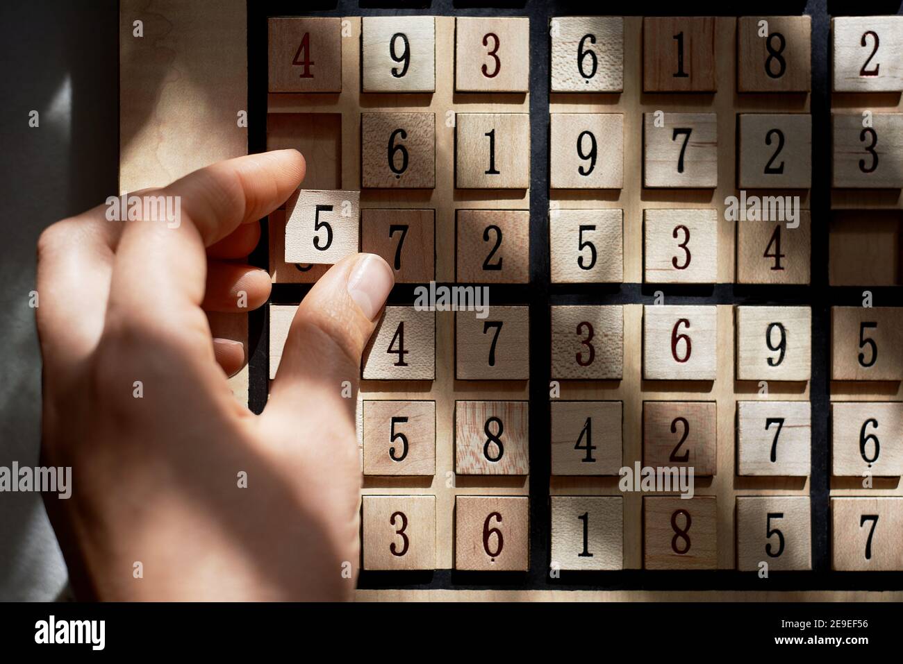 Playing on Sudoku game board with puzzle stock photo Stock Photo