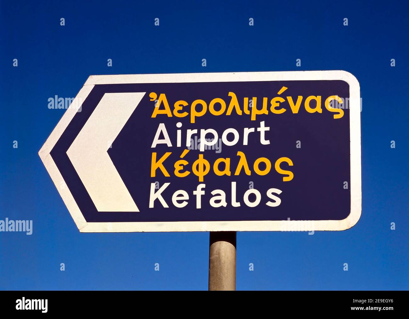 A sign in English and Greek directing tourists to the Airport and to the town of Kefalos on the Greek Island of Kos Stock Photo