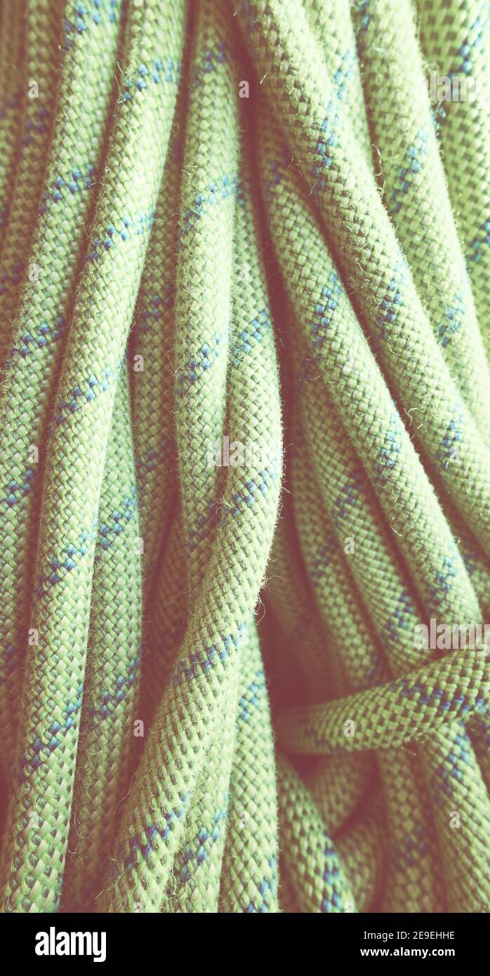 Abstract background made of climbing rope, selective focus, color toning applied. Stock Photo