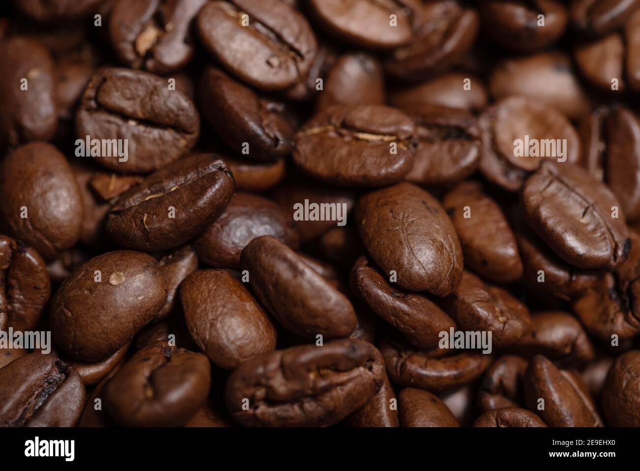 Fresh brown roasted coffee beans background Stock Photo - Alamy