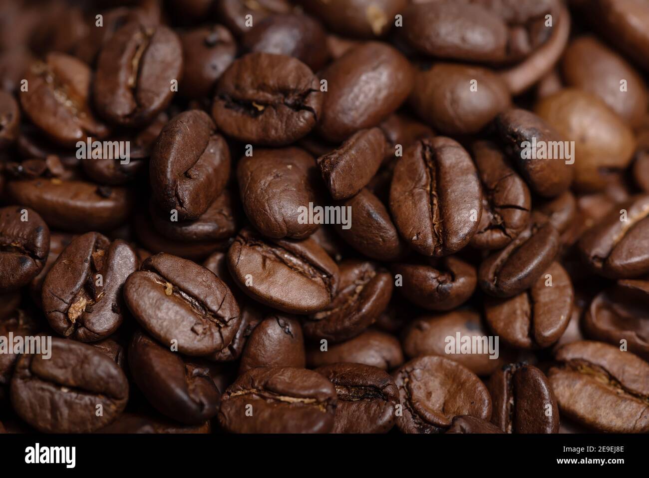 Fresh brown roasted coffee beans background Stock Photo - Alamy