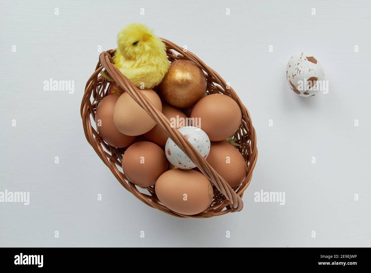 Easter basket with eggs and hatched chick. Stock Photo