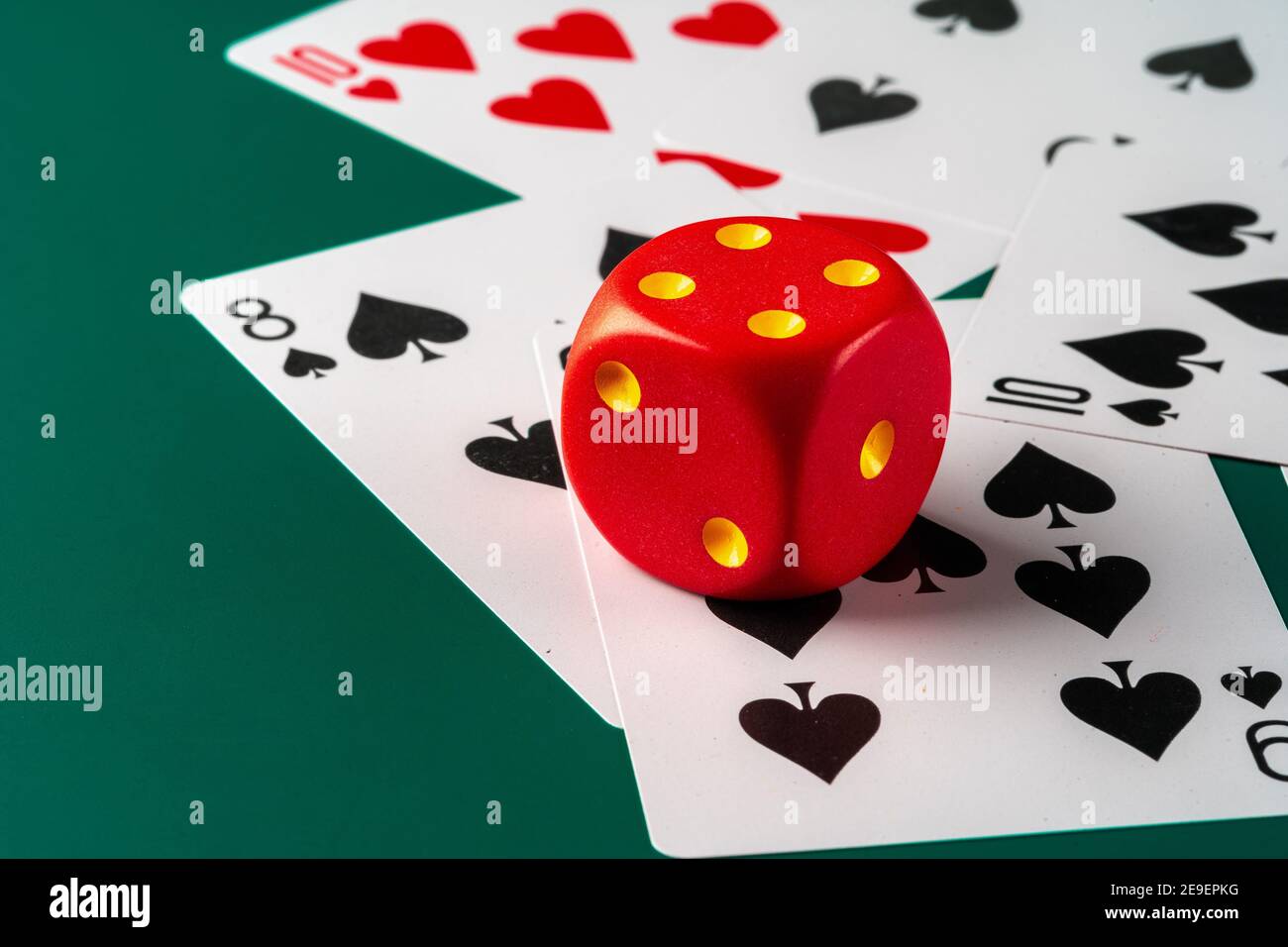 Playing cards with red dice. Casino and gambling concept Stock Photo