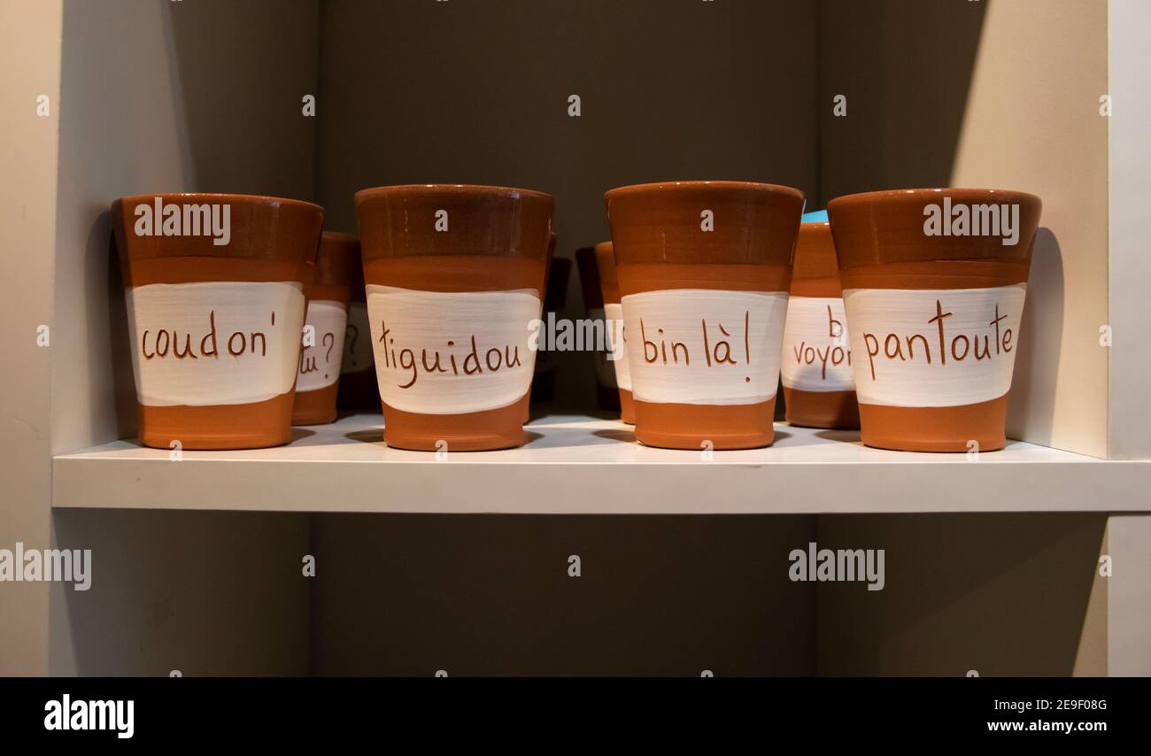 November 9, 2020 - Montreal, Qc, Canada: Quebecois French Canadian expressions on craft terracotta mugs in a souvenir shop, art design Stock Photo