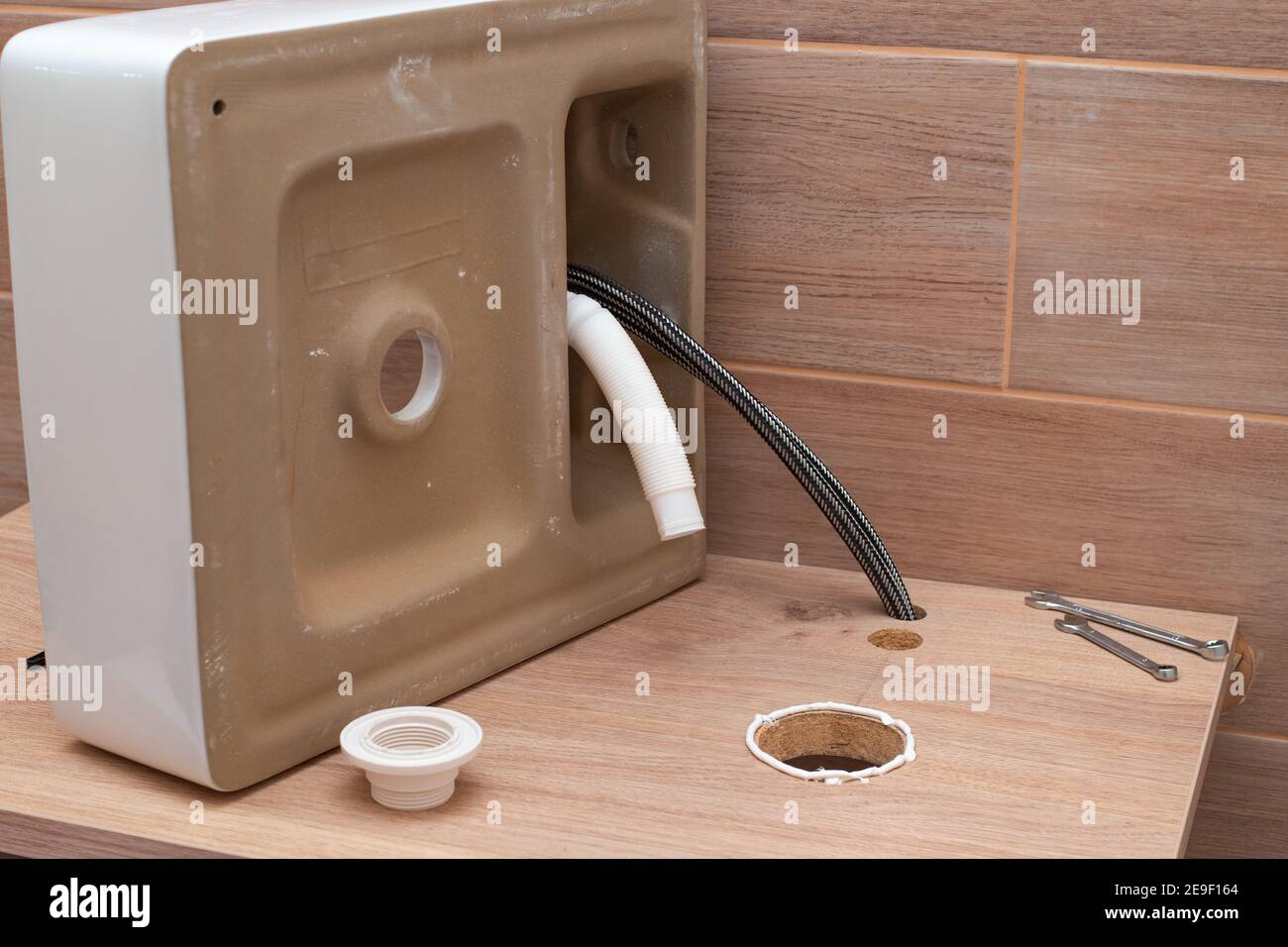 Installing the sink in a wooden countertop. Renovation and interior of