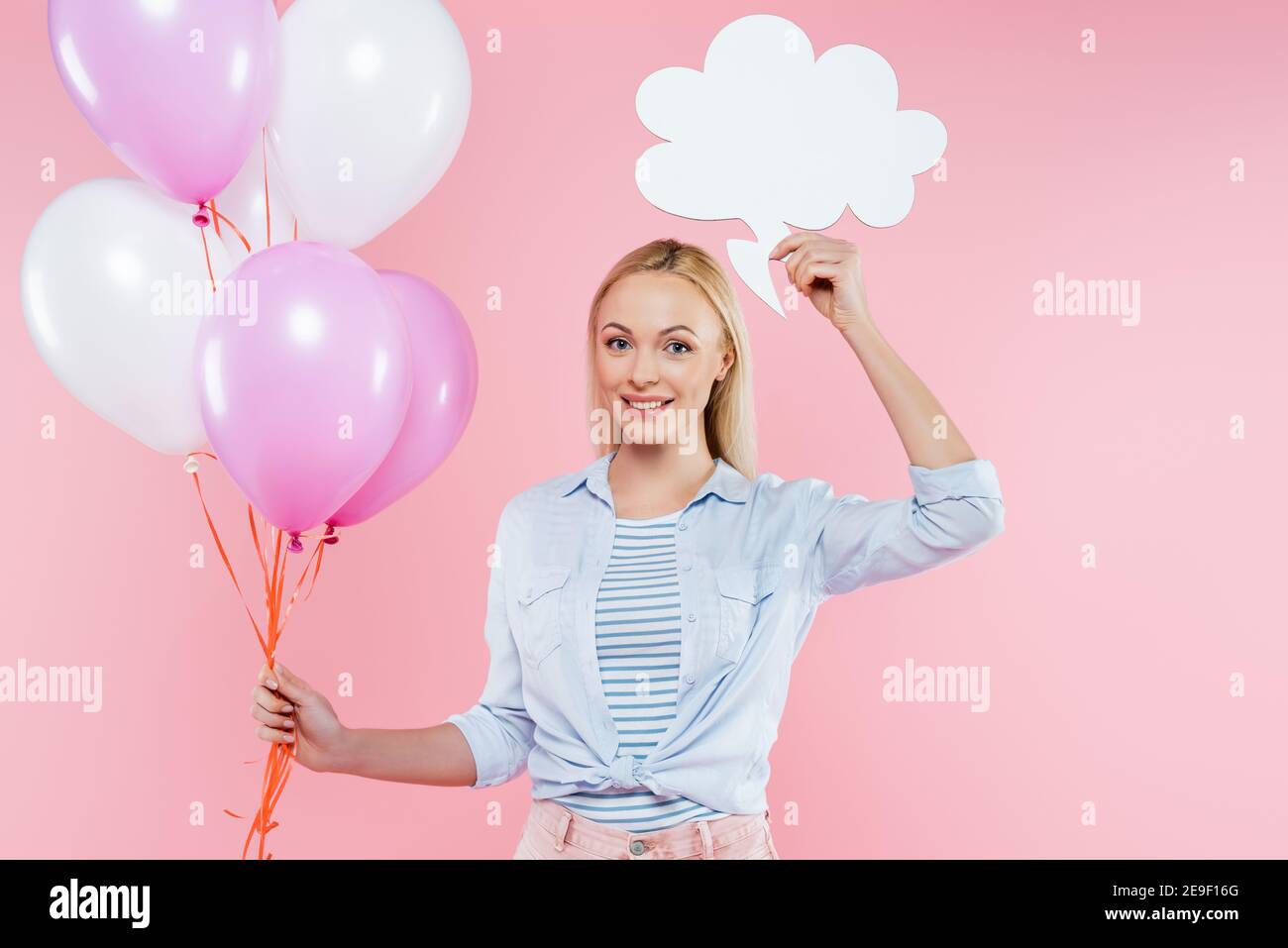 happy woman holding balloons and blank thought bubble isolated on pink happy woman holding balloons and blank thought bubble isolated on pink