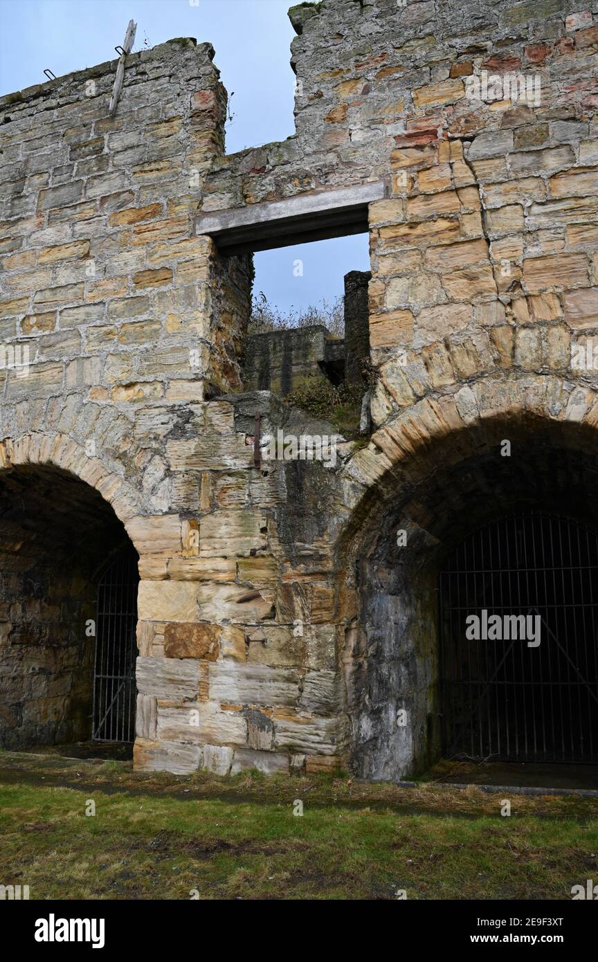 An exterior view of an old stone built lime kiln in the Fife coastal