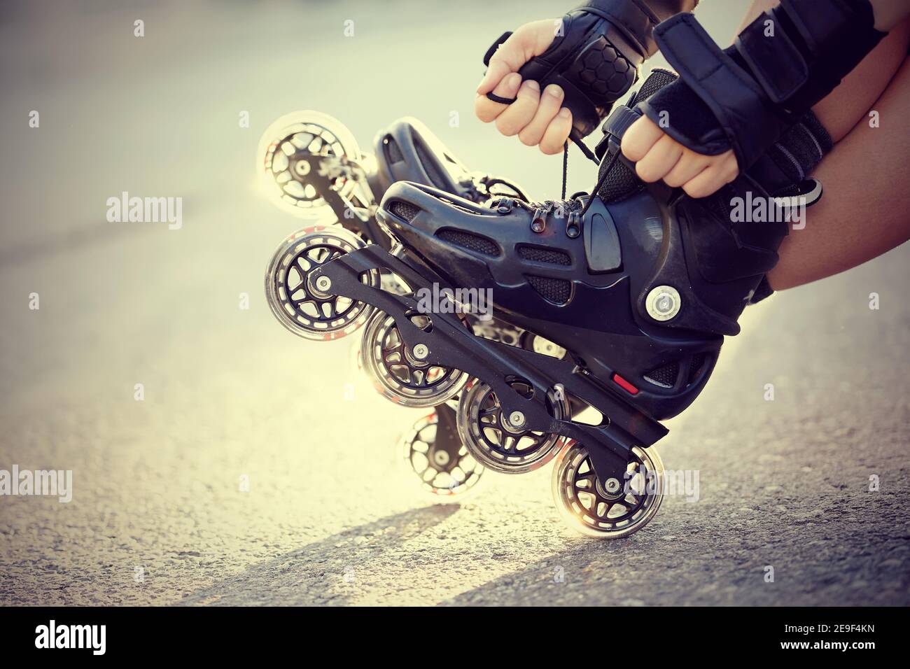 Setting of laces on black roller skates Stock Photo Alamy