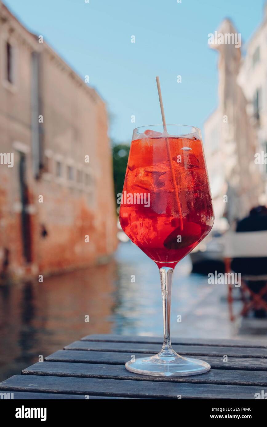 Glass of refreshing Aperol Spritz cocktail served on the deck bar in