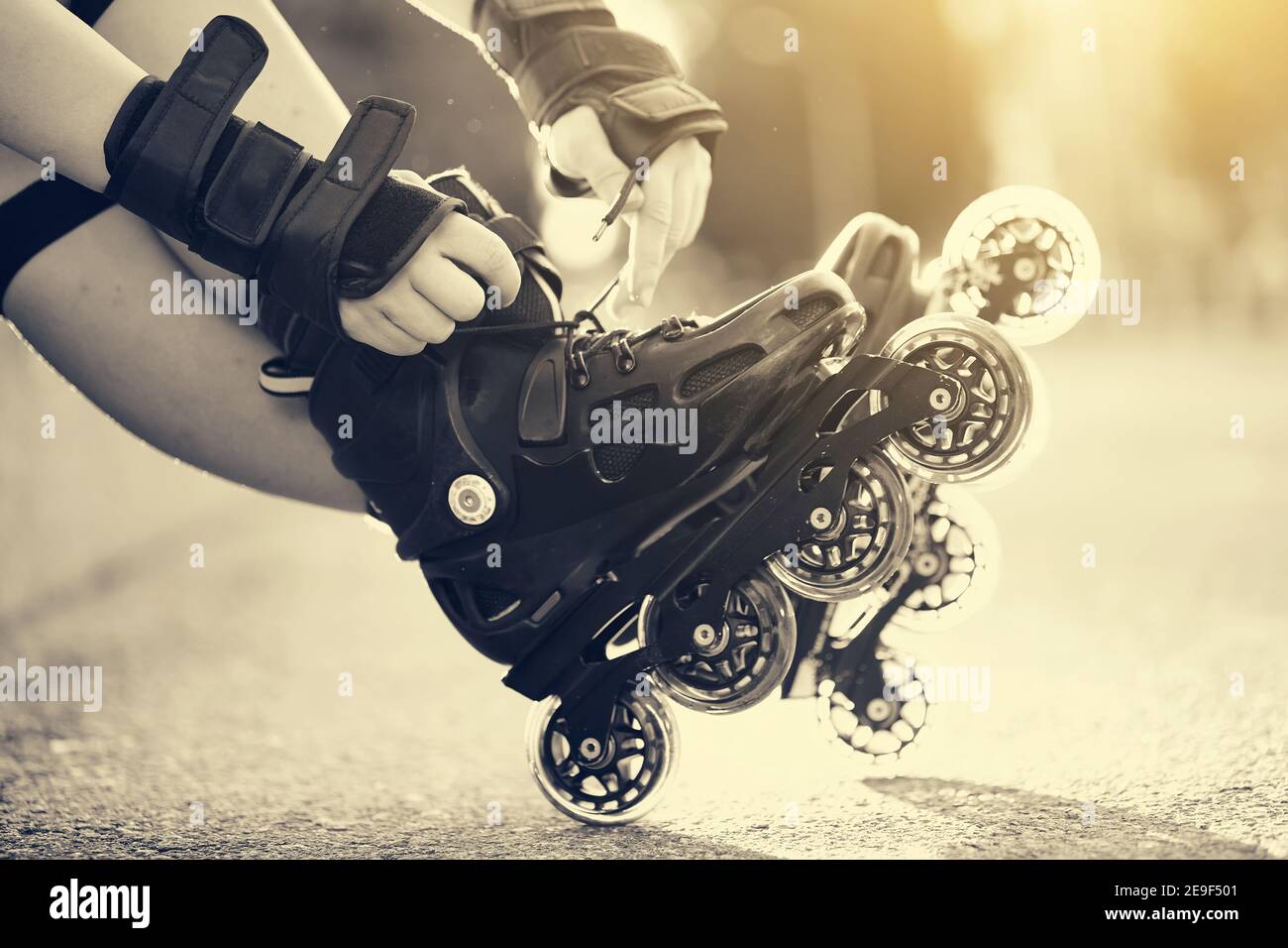 Setting of laces on black roller skates Stock Photo Alamy