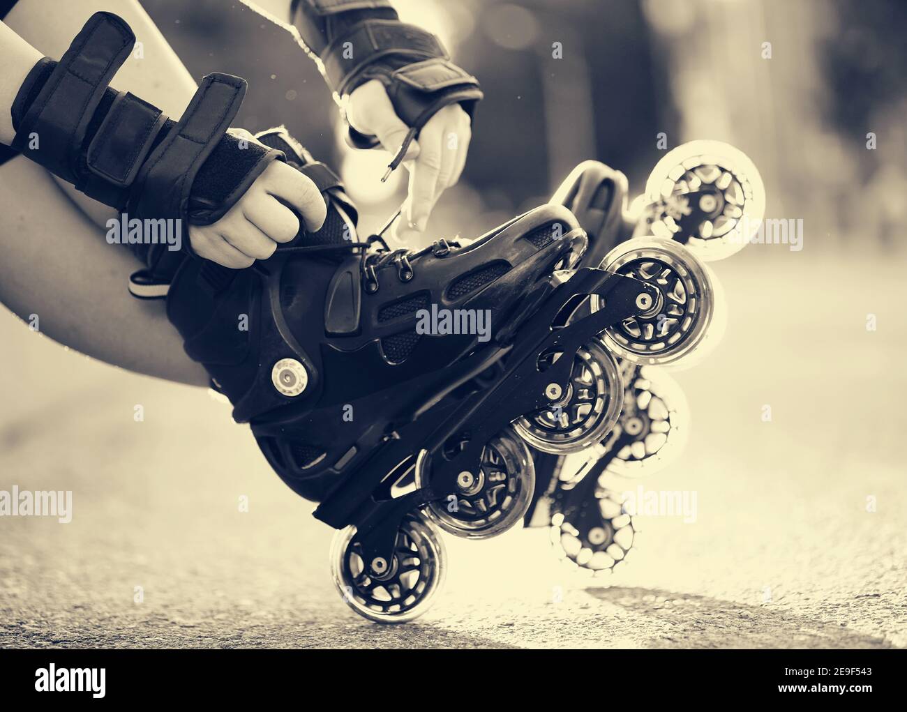 Setting of laces on black roller skates Stock Photo Alamy