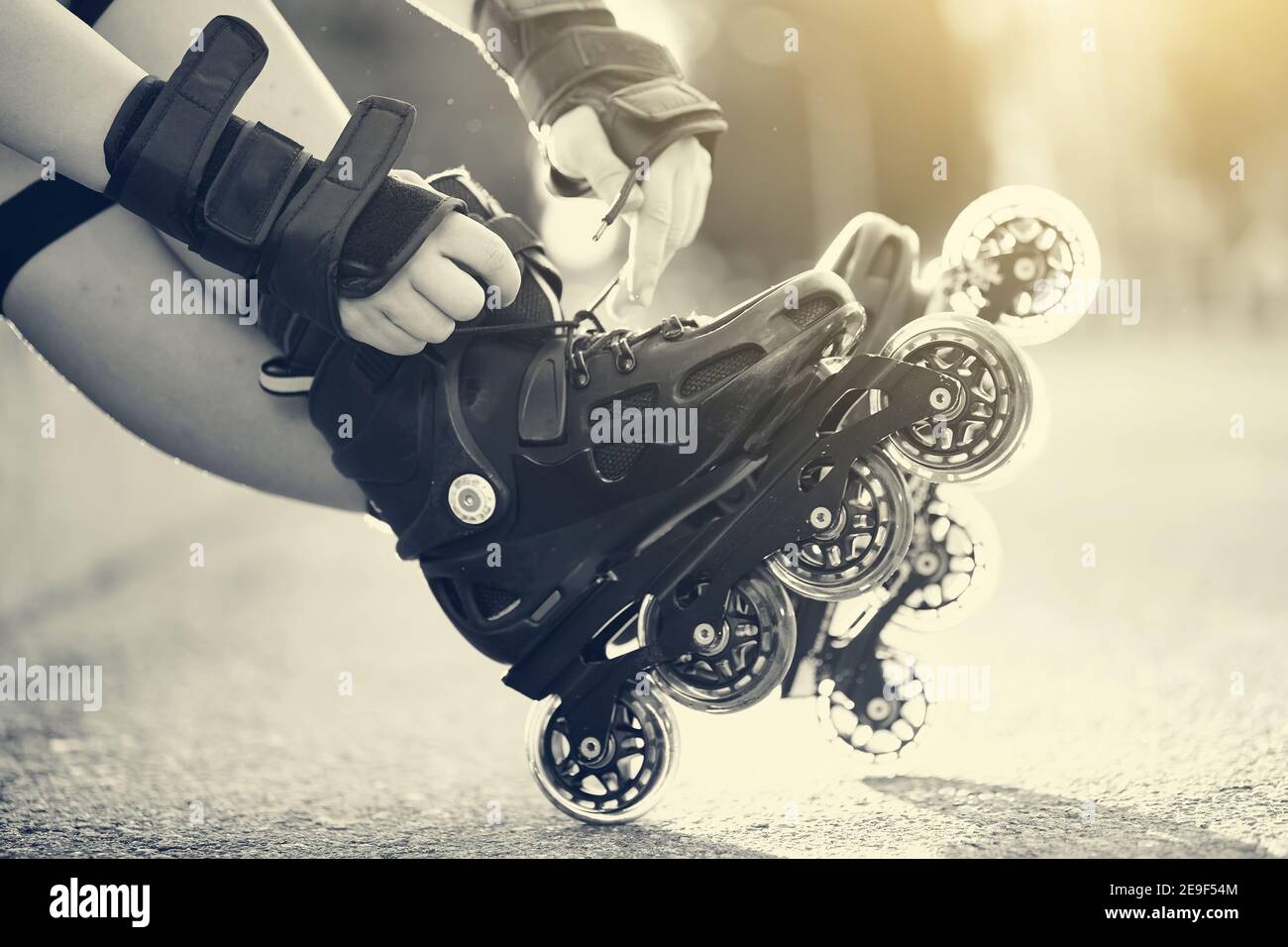 Setting of laces on black roller skates Stock Photo Alamy