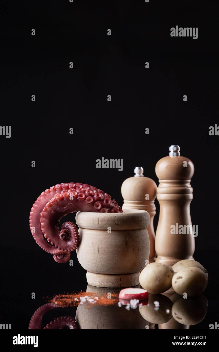 tentacles of stew octopus on dark background Stock Photo - Alamy