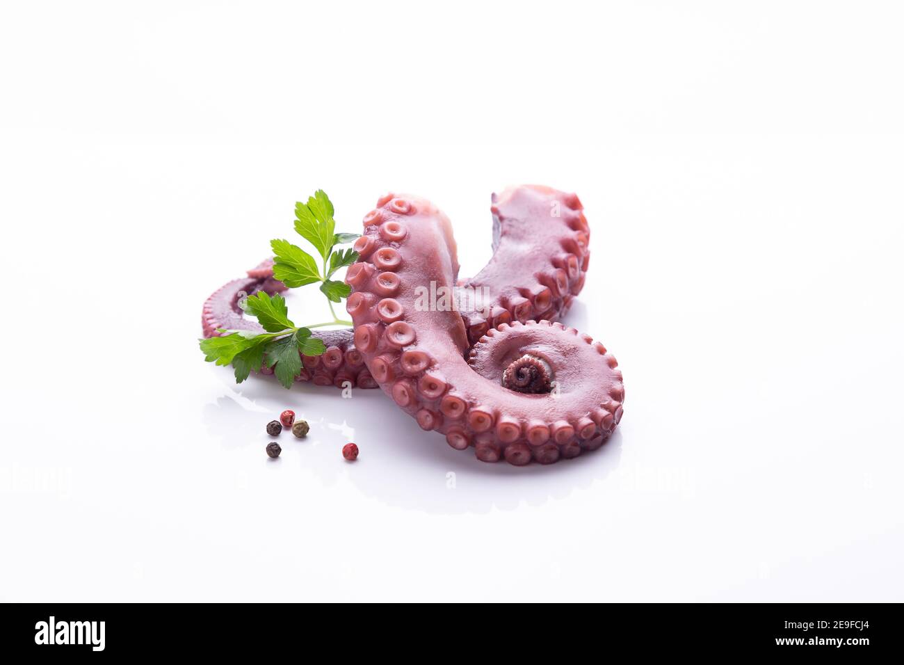 tentacles of stew octopus isolated on white background Stock Photo - Alamy