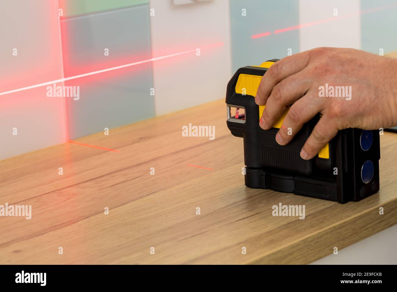 Electronic laser pointing straight lines. Checking angles and setting