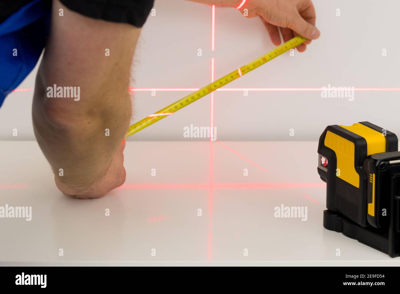a specialist makes measurements using an electronic laser measuring the angles Stock Photo