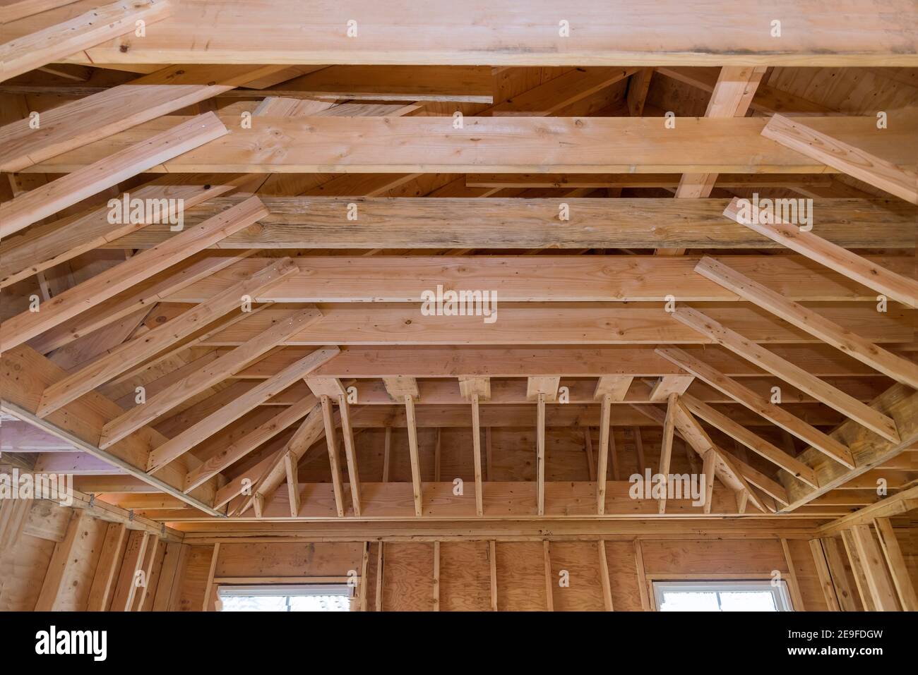 Wooden beams ceiling framed building under construction interior
