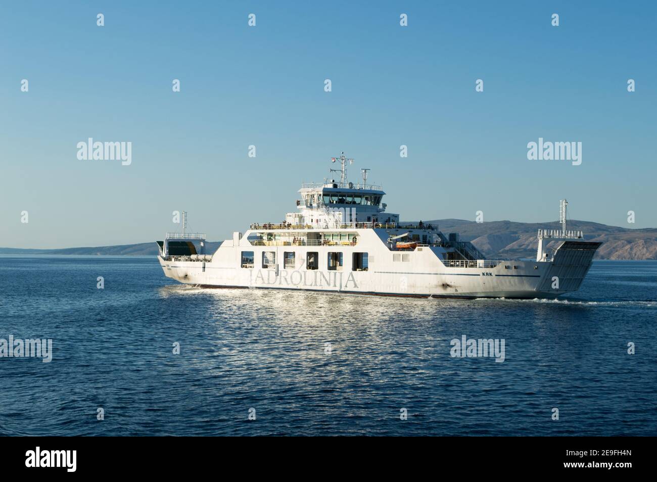 Croatia - September 2020: Passenger and car ferry ship connecting Croatian islands Krk and Cres, owned by Jadrolinija, Croatian shipping company Stock Photo