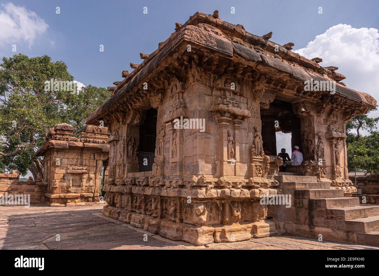 Bagalakote, Karnataka, India - November 7, 2013: Pattadakal temple complex. Closeup off Brown stone Nandi shrine in front of Virupaksha temple under b Stock Photo