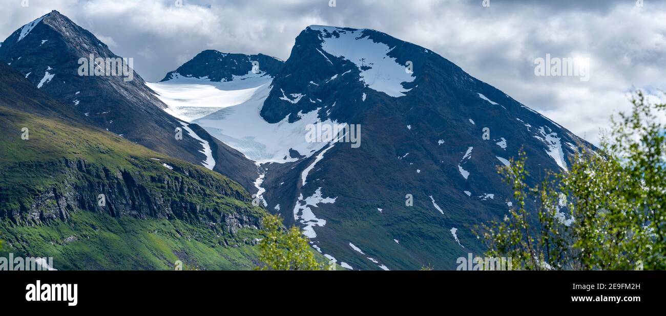 Close up landscape of Akka Mountain Massif and Top Glacier With snow cover in Swedish Big Lake National park North of Arctic Circle in Lapland, Sweden Stock Photo