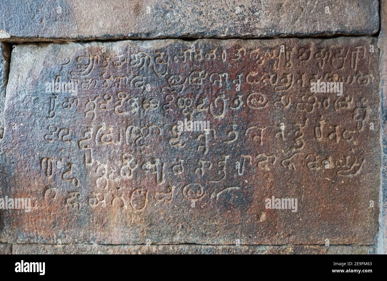 Bagalakote, Karnataka, India - November 7, 2013: Pattadakal temple complex. Closeup of gray stone historic script at entrance to Virupaksha temple. Stock Photo
