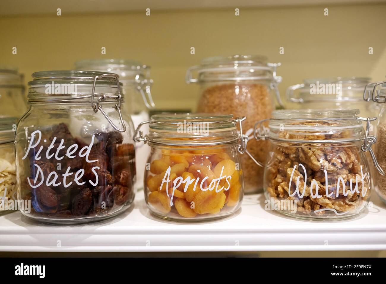 Photograph of dried fruit, nuts and seeds in glass jars Stock Photo Alamy