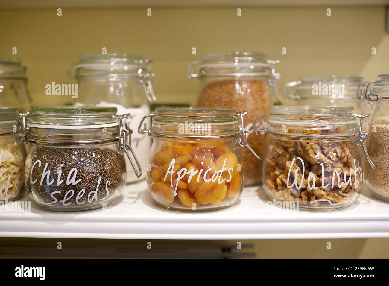 Photograph of dried fruit, nuts and seeds in glass jars Stock Photo Alamy