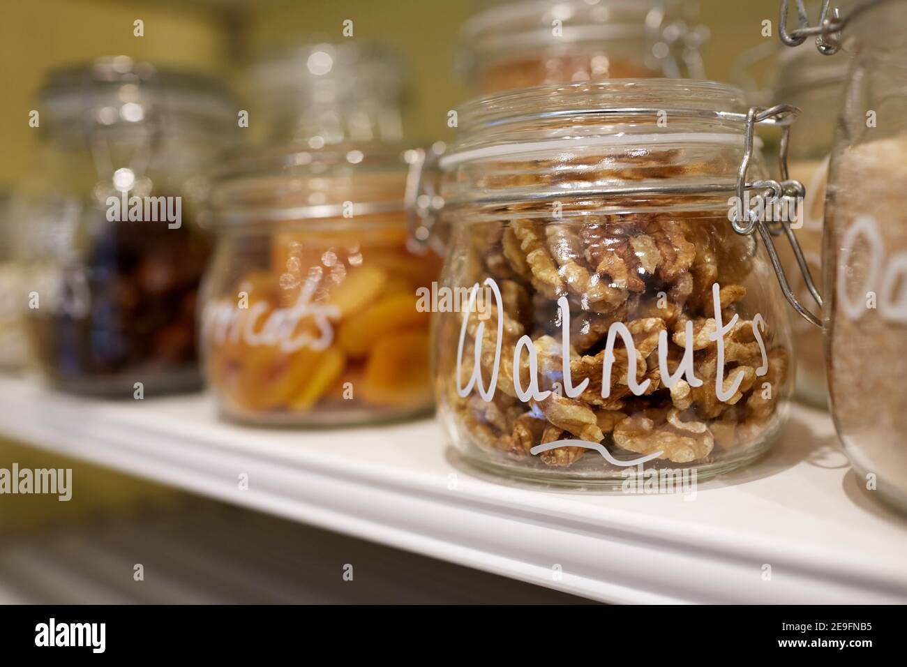 Photograph of dried fruit, nuts and seeds in glass jars Stock Photo Alamy