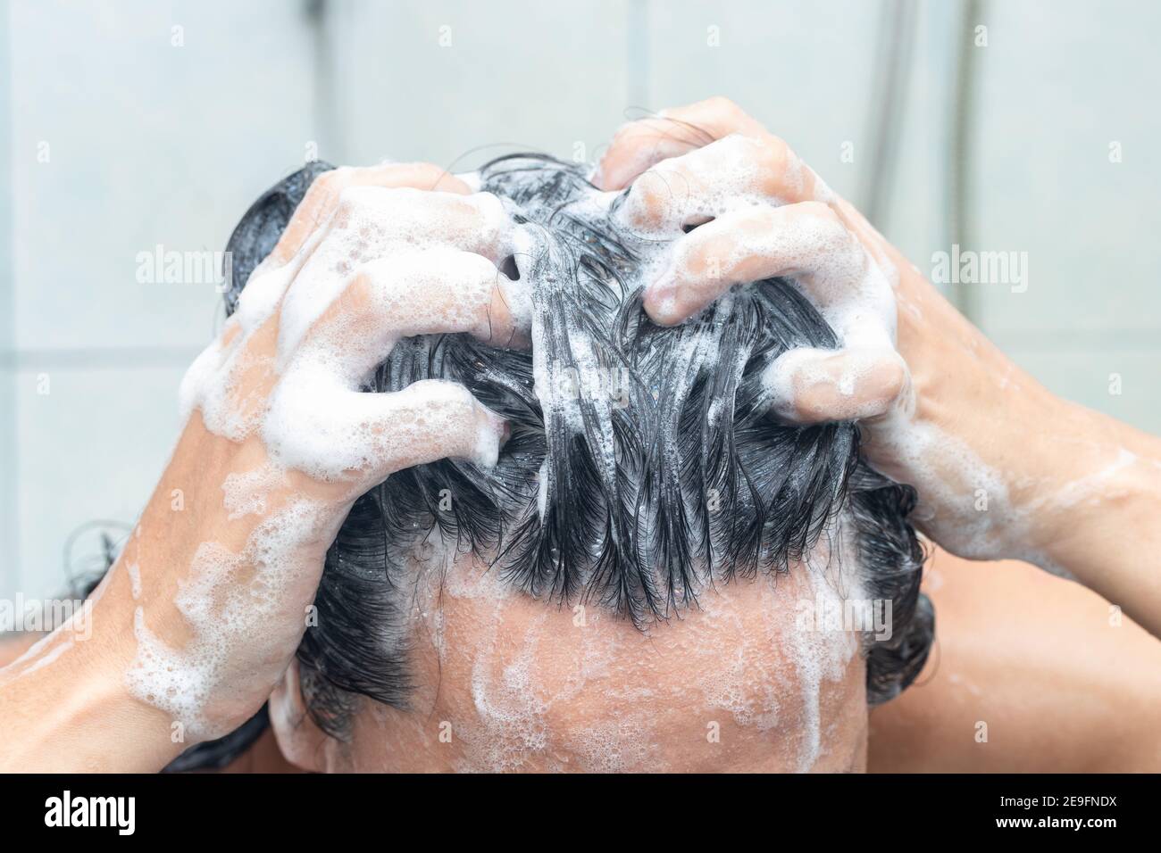 Asian woman are washing their hair in a bathroom with a full head