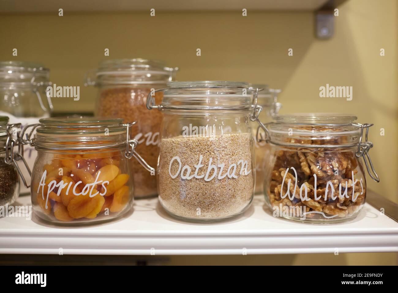 Photograph of dried fruit, nuts and seeds in glass jars Stock Photo Alamy