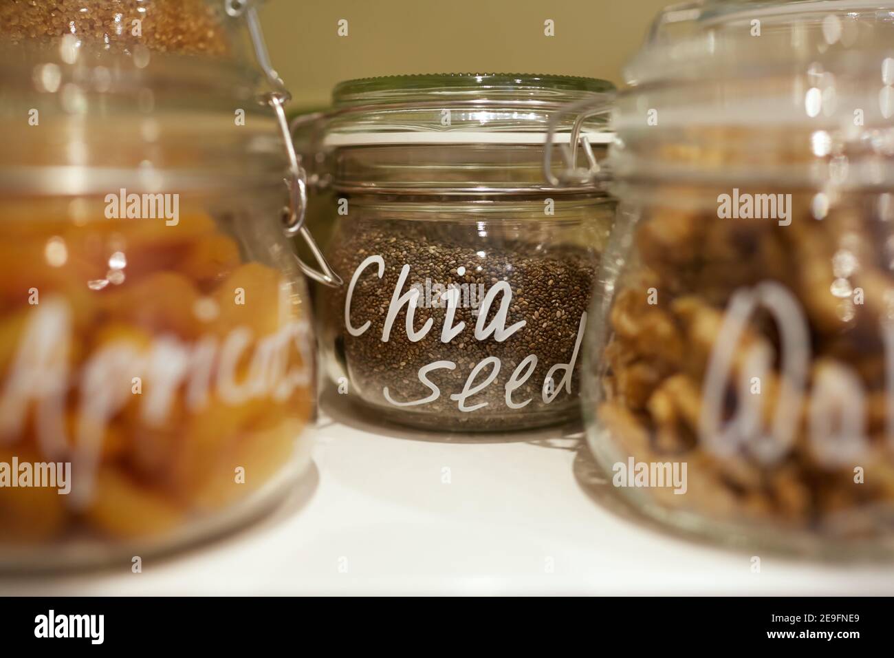 Photograph of dried fruit, nuts and seeds in glass jars Stock Photo Alamy