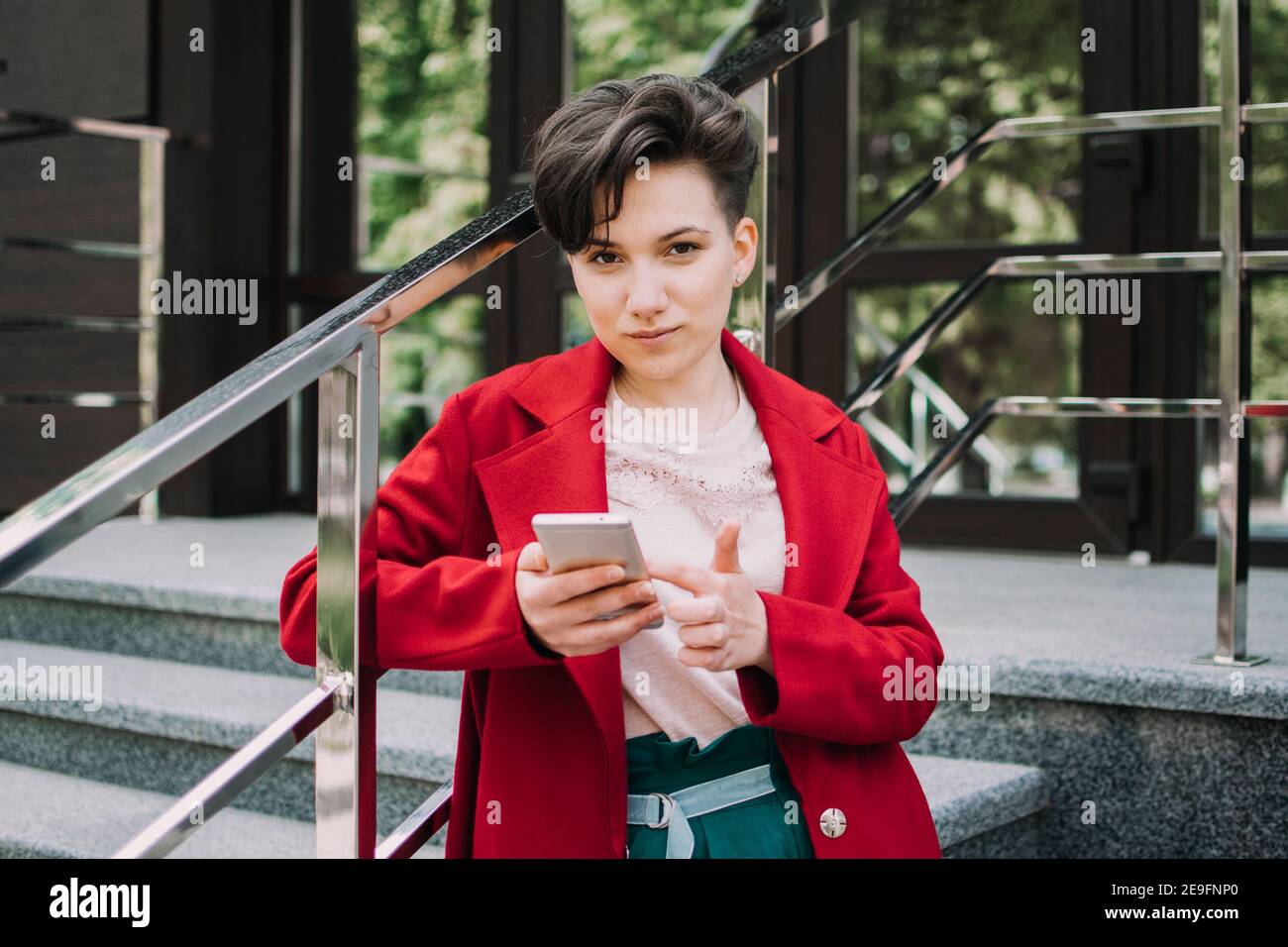 Gen Z Social Media Influencer Technology Youth Millennial People Concept Young Brunette Girl With Short Hair Using Mobile Phone Outdoor Stock Photo Alamy