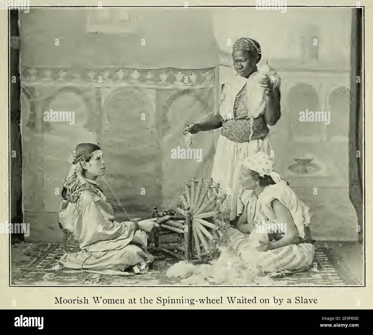 1906 photograph of two moorish woman with an african slave. Stock Photo