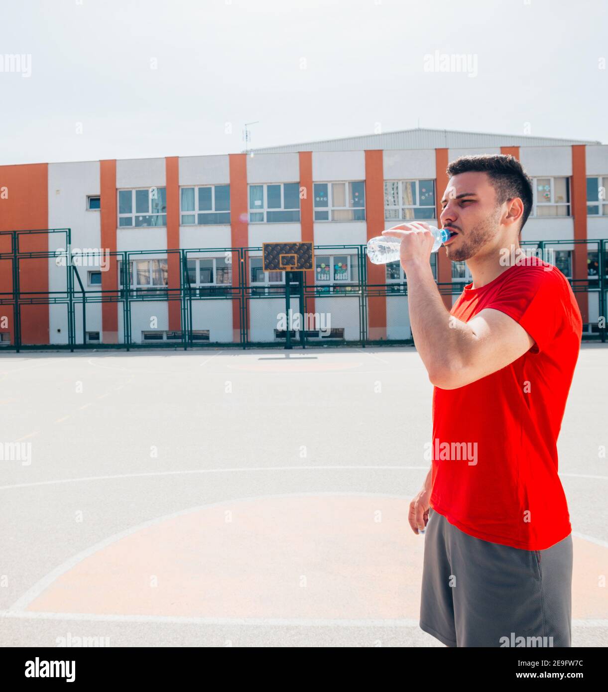 Athletes drinking water and having a break after a long exhausting