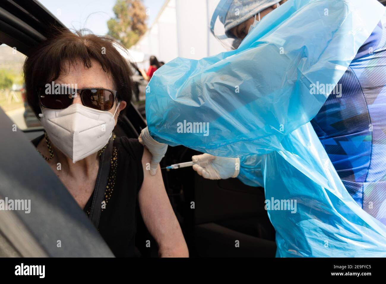 Santiago, Metropolitana, Chile. 4th Feb, 2021. A woman is vaccinated in the car, with the Sinovac vaccine, on the second day of mass vaccination in Chile. Credit: Matias Basualdo/ZUMA Wire/Alamy Live News Stock Photo