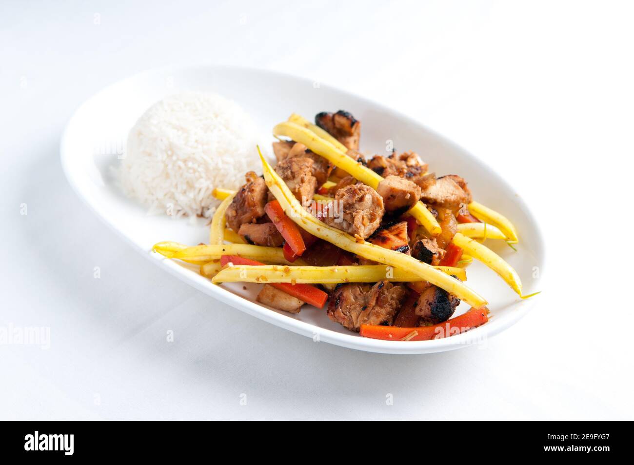 orange and ginger chicken thigh stir fry Stock Photo - Alamy