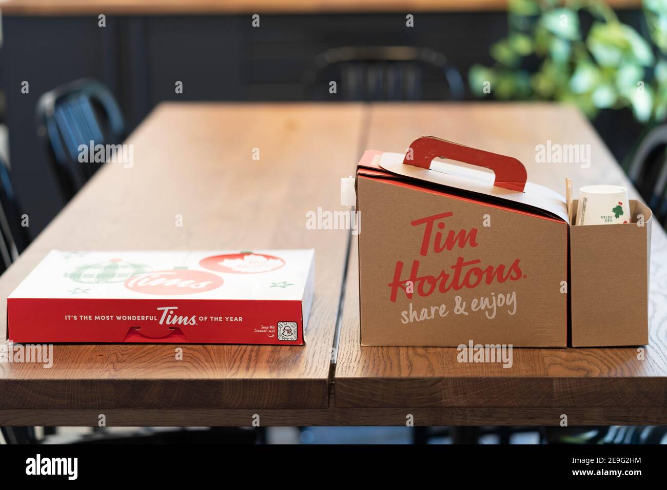 February 3 2021 - Calgary , alberta Canada - Tim Hortons donut box and  coffee on office table Stock Photo - Alamy
