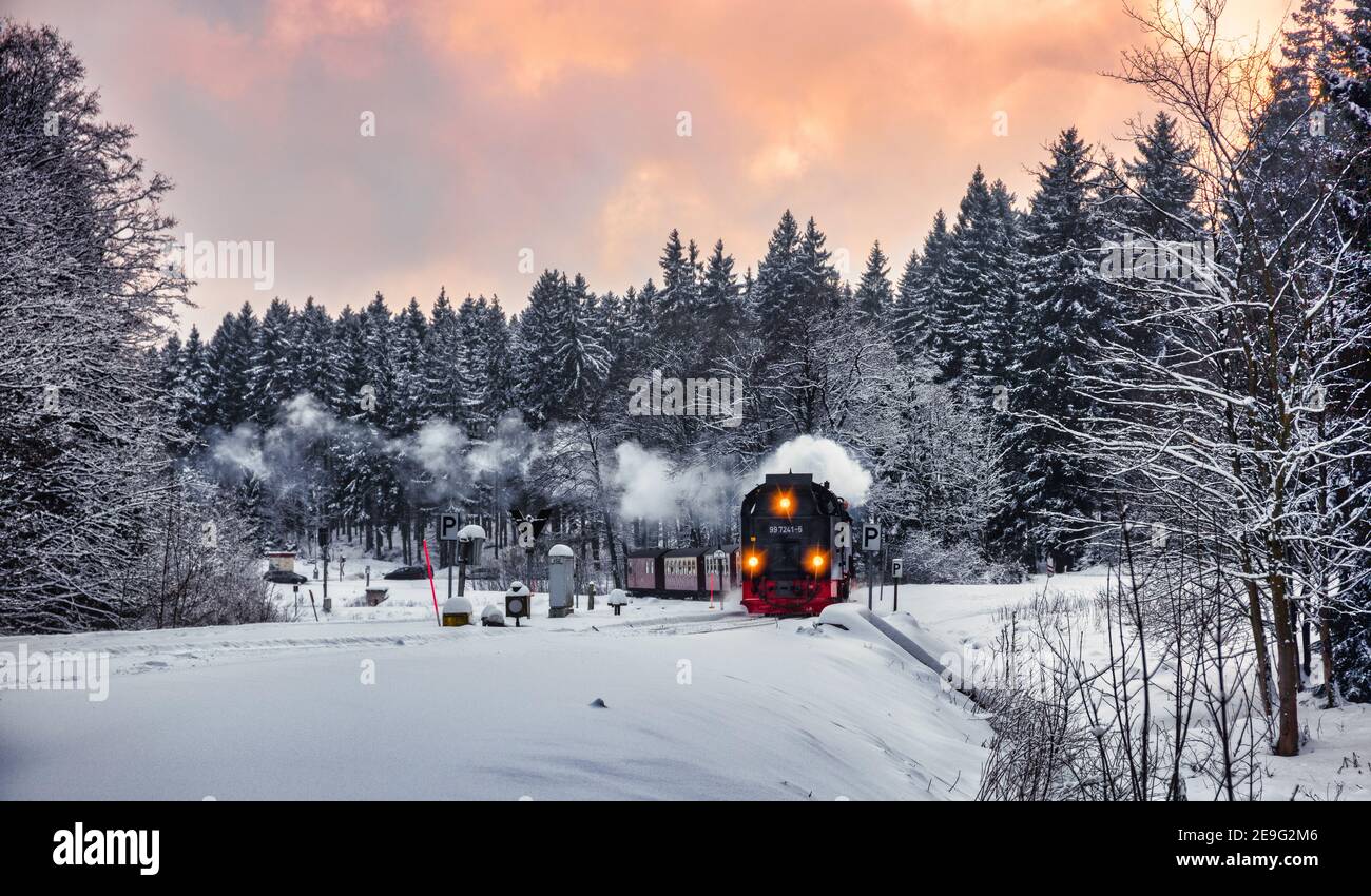 Steam train on the way to Brocken through winter landscape Stock Photo