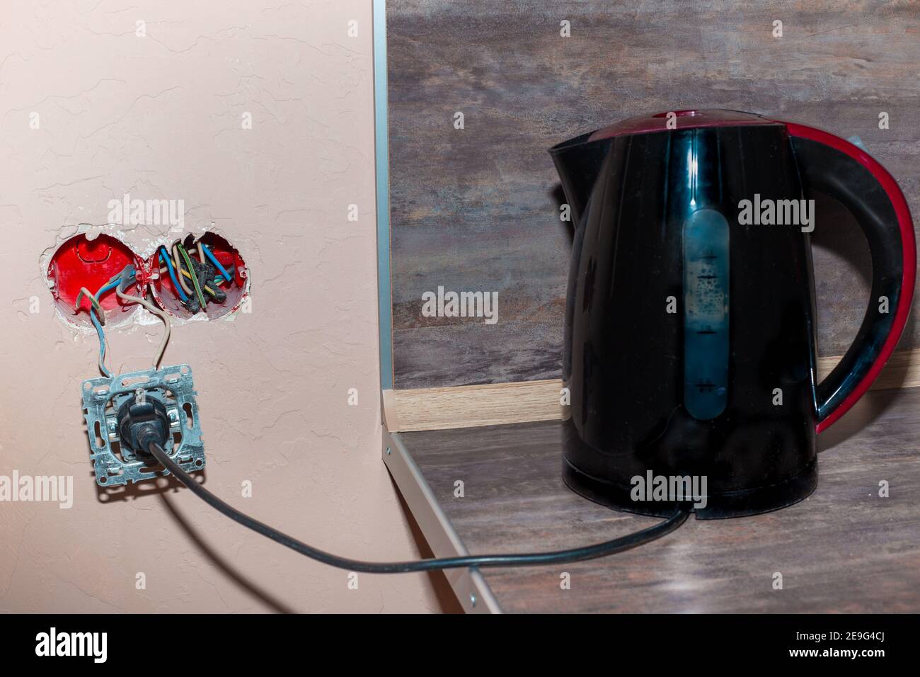 Electric kettle with stand isolated on white background. Electric cord with  plug Stock Photo - Alamy