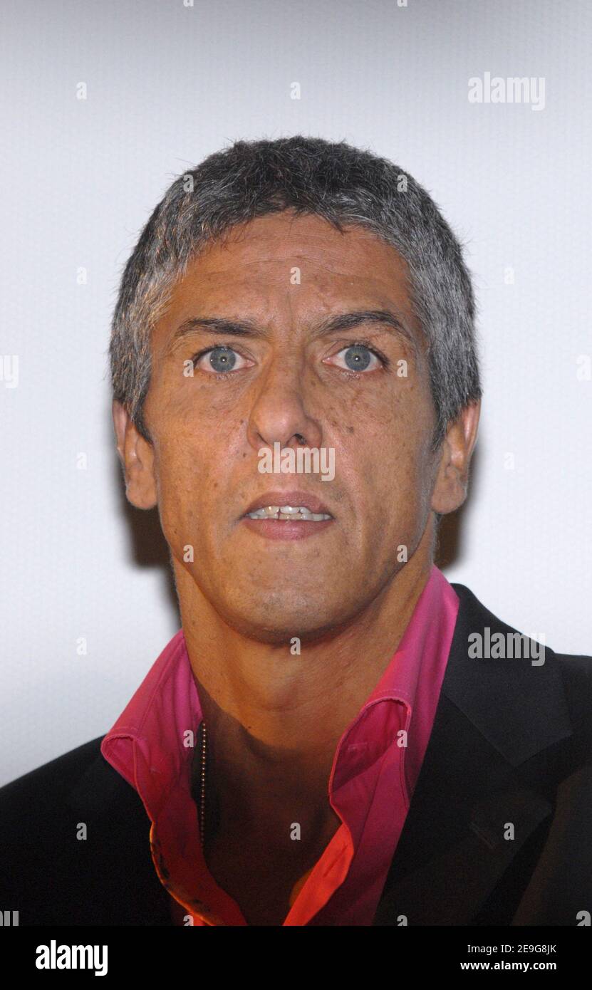 Cast member Samy Naceri poses for pictures as he arrives to the