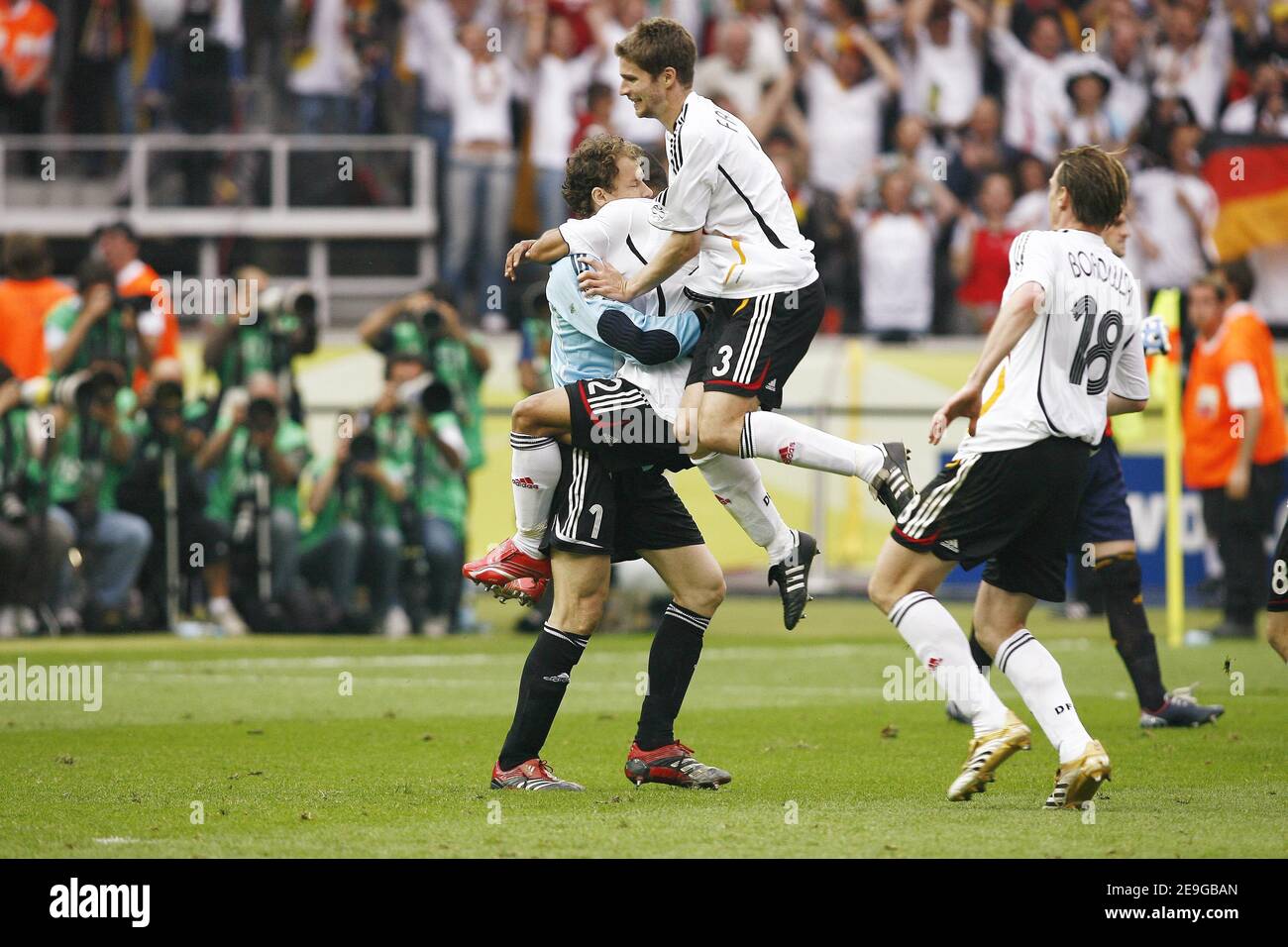 Germany's Arne Friedrich and Marcell Jansen congratulate the goalkeeper Jens Lehmann after stopping two penaltys during the FIFA World Cup 2006, quarter final, Germany vs Argentina, in Berlin, Germany, on June 30, 2006. The game ended in draw 1-1 and Germany won (4-2) in a penalty-kick shootout. Photo by Christian Liewig/ABACAPRESS.COM Stock Photo