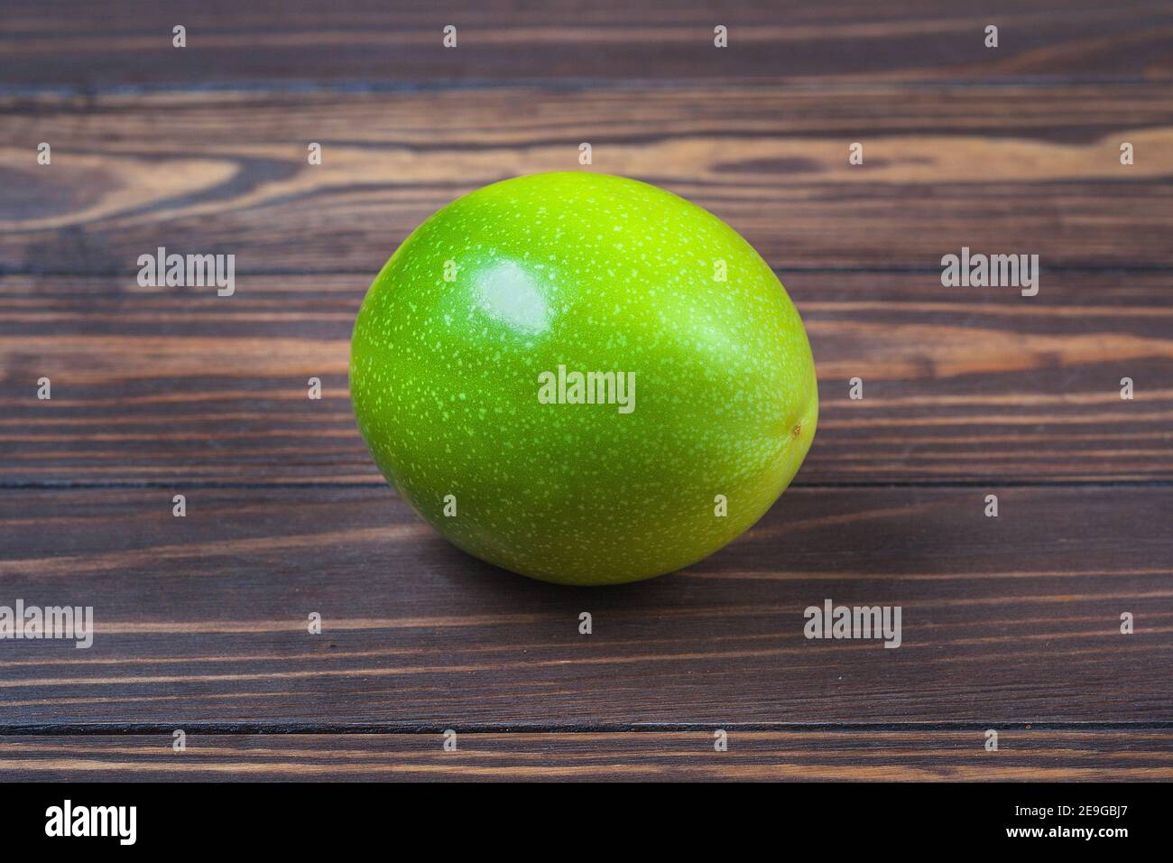 Ripe passionfruit fruit, lie on a background of wooden boards. High quality photo Stock Photo