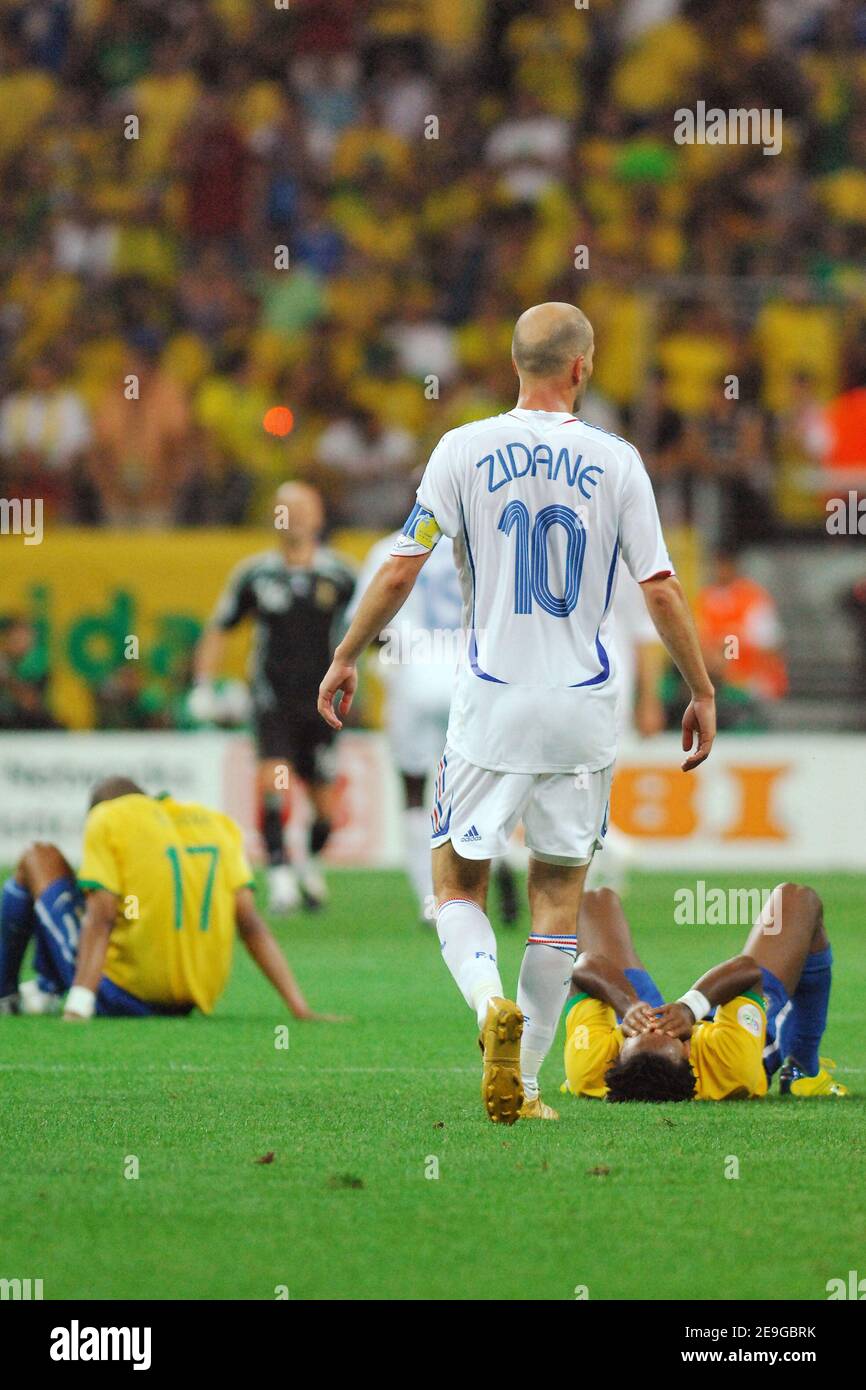 France's Zinedine Zidane applauds as Brazil's Ze Roberto lies on the pitch  after the World Cup 2006, quater-final, Brazil vs France at the  Commerzbank-Arena stadium in Frankfurt, Germany on July 1, 2006.