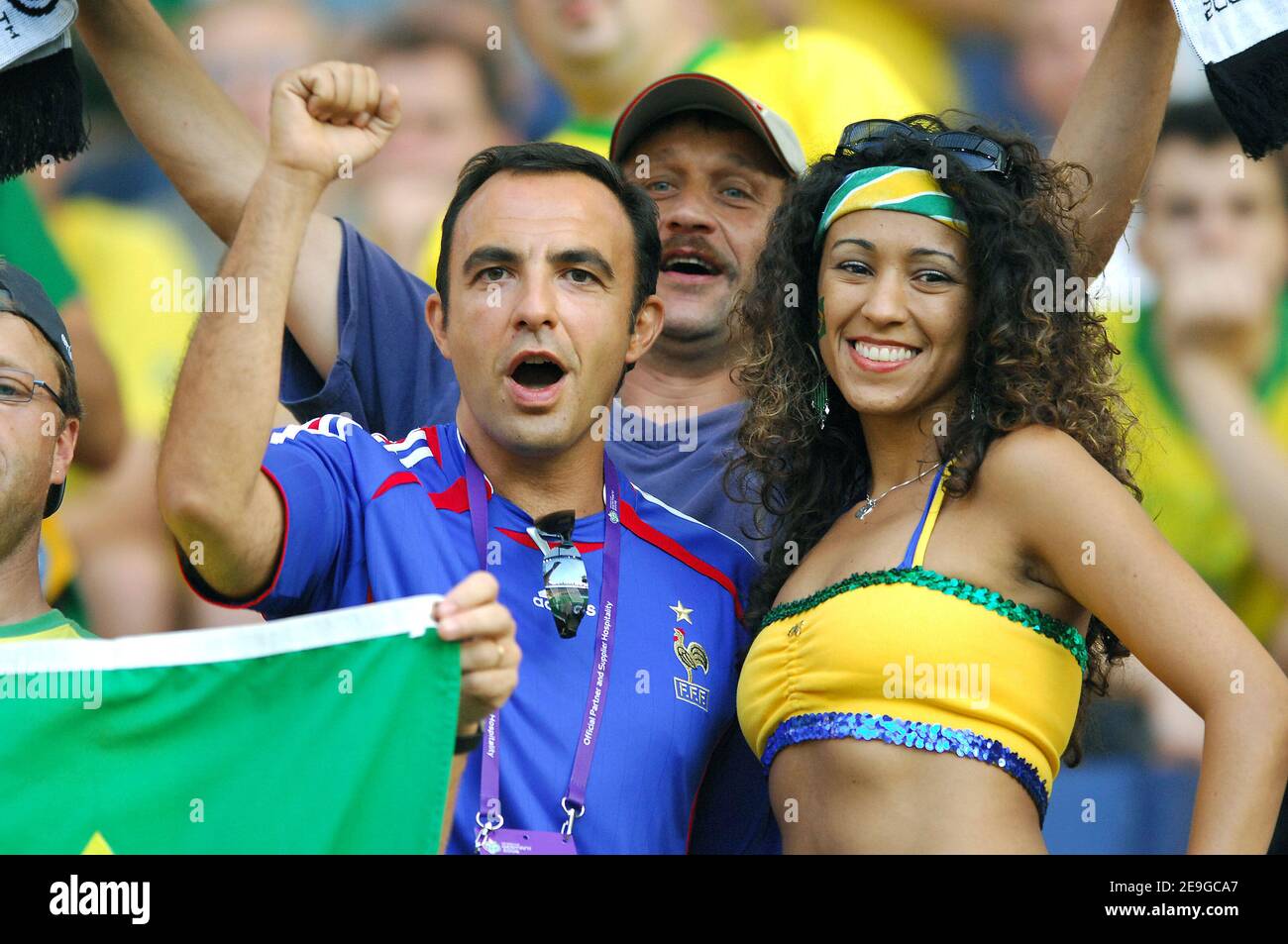 Greek born TV presenter Nikos Aliagas supports French team and Brazilian  female supporter during the World Cup 2006, quater-final, Brazil vs France  at the Commerzbank-Arena stadium in Frankfurt, Germany on July 1,