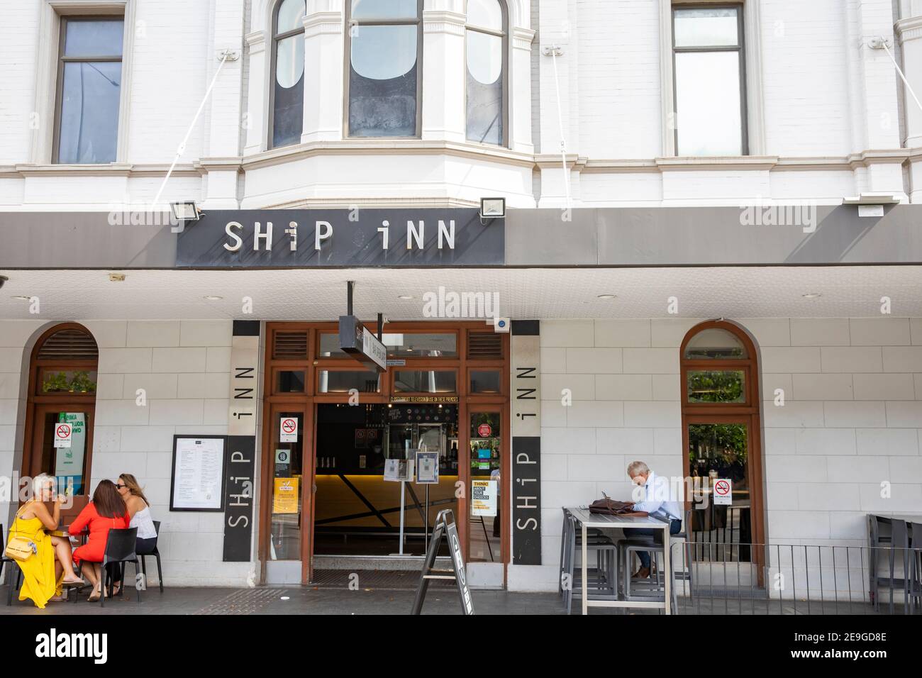 The Ship inn public house and bar in Sydney Circular Quay area with people enjoying a drink outside on a summers day,Sydney,Australia Stock Photo