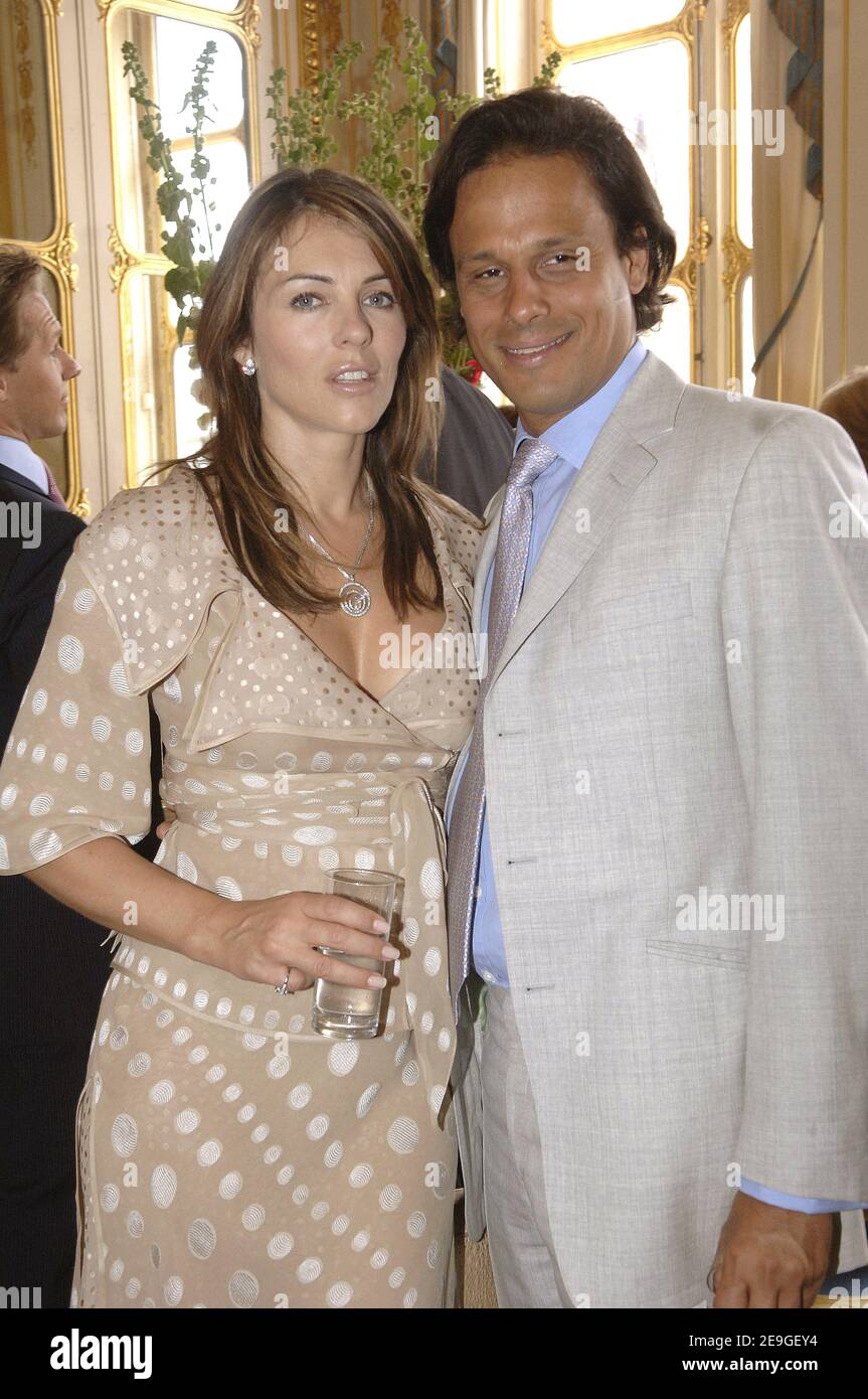 Actress Liz Hurley and his boyfriend Arun Nayar attend the event where Italian fashion designer Valentino has been honored by the medal of 'Chevalier de la Legion d'Honneur' in Paris, France, on July 6, 2006. Photo by Giancarlo Gorassini/ABACAPRESS.COM Stock Photo