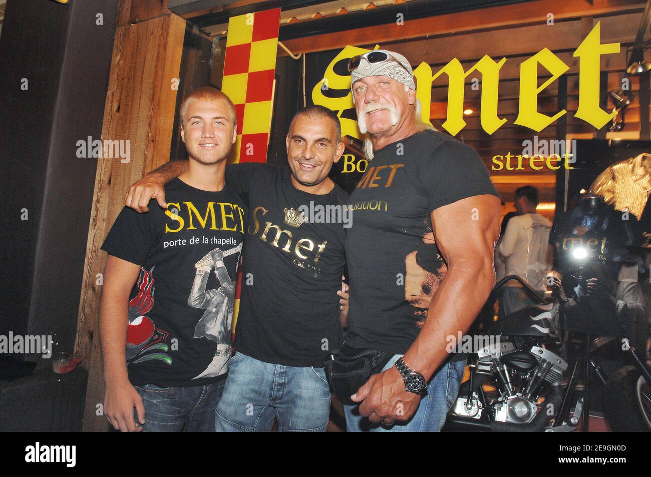 Christian Audigier presents, with Hulk and Nick Hogan, 'Smet ', his latest fashion collection honoring French rock legend Johnny Hallyday in his store of Melrose Avenue in Los Angeles, CA, USA on July 29, 2006. Photo by Lionel Hahn/ABACAPRESS.COM Stock Photo