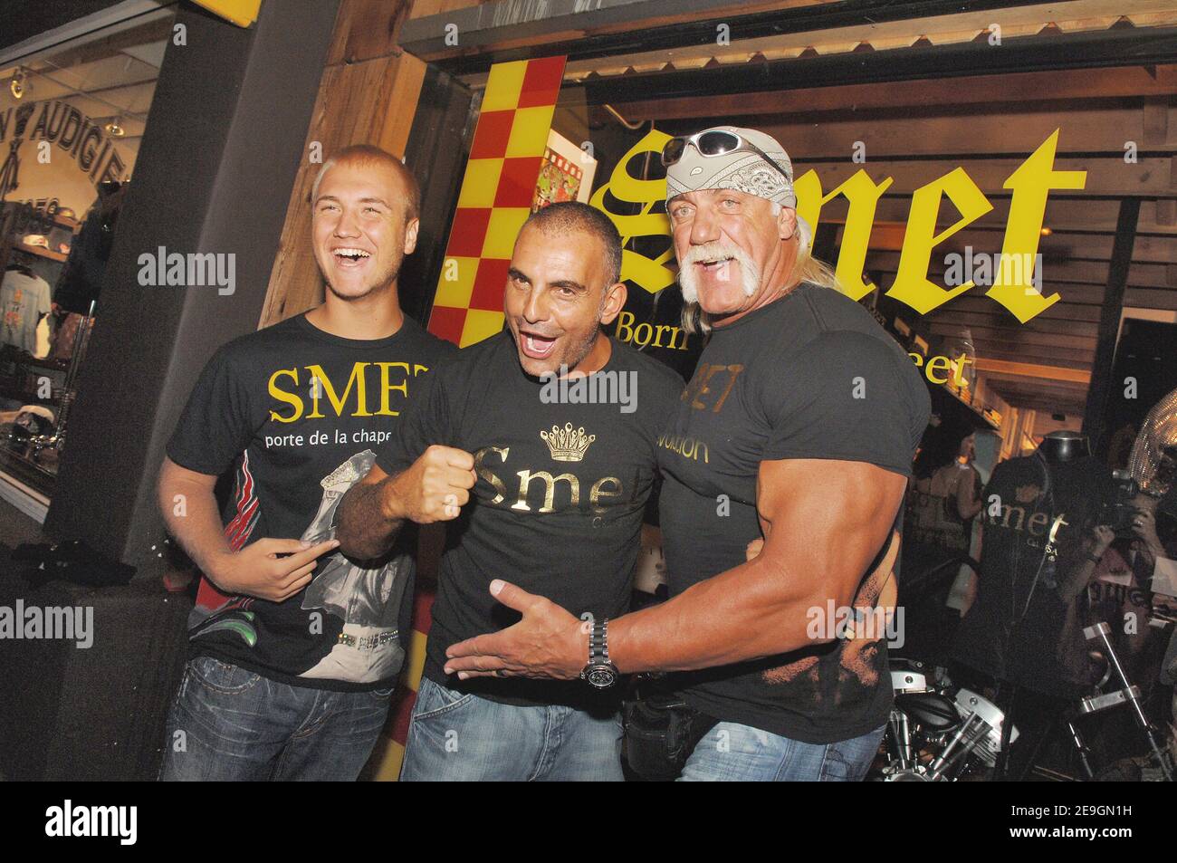 Christian Audigier presents, with Hulk and Nick Hogan, 'Smet ', his latest fashion collection honoring French rock legend Johnny Hallyday in his store of Melrose Avenue in Los Angeles, CA, USA on July 29, 2006. Photo by Lionel Hahn/ABACAPRESS.COM Stock Photo